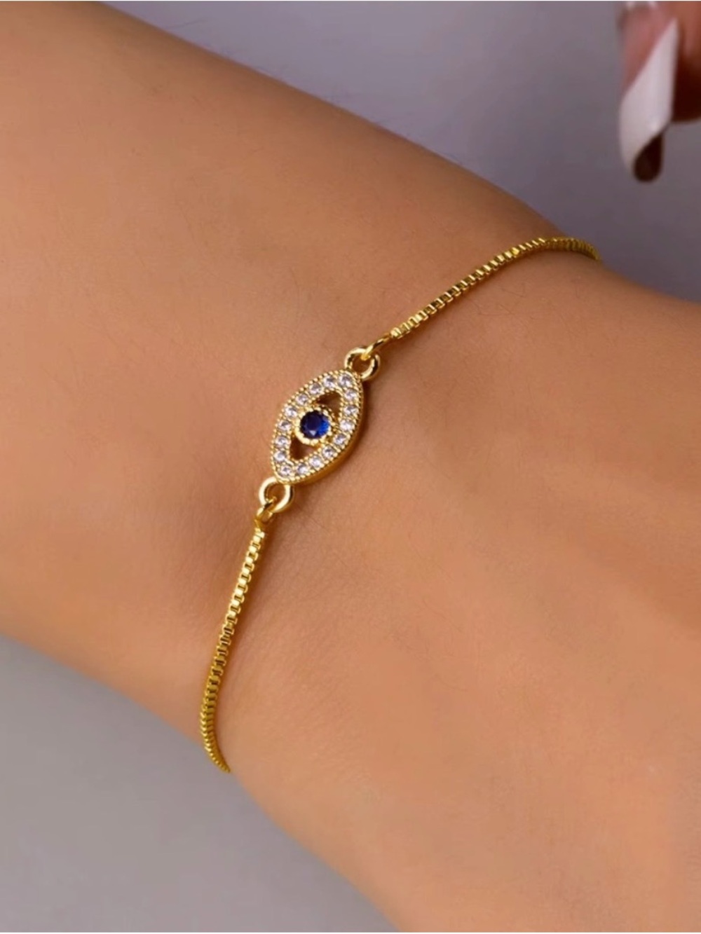 Gold Evil Eye Bracelet with Navy Center Stone